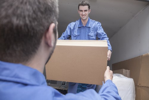 London street with residential flats and parking considerations for removals