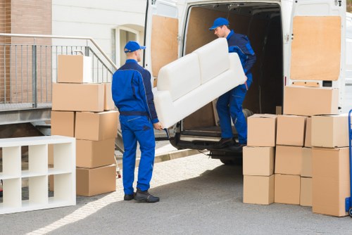 Removal van ready for a London home move near residential buildings