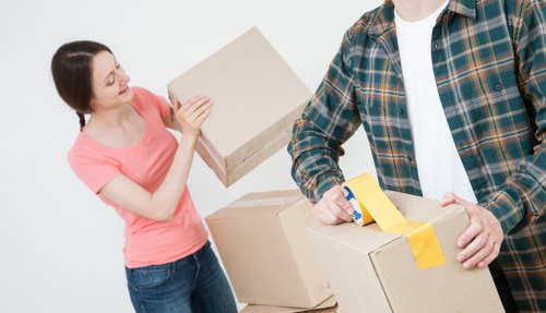 Packed moving boxes and furniture prepared for transport in London