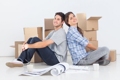 Local movers loading furniture into a truck for a London home move