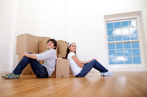 Removal team preparing a London home move with boxes and furniture
